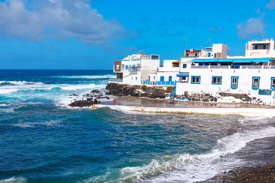 El Cotillo coastal town in Fuerteventura, Canary Islands. Serene beach scene with gentle waves lapping at the shore