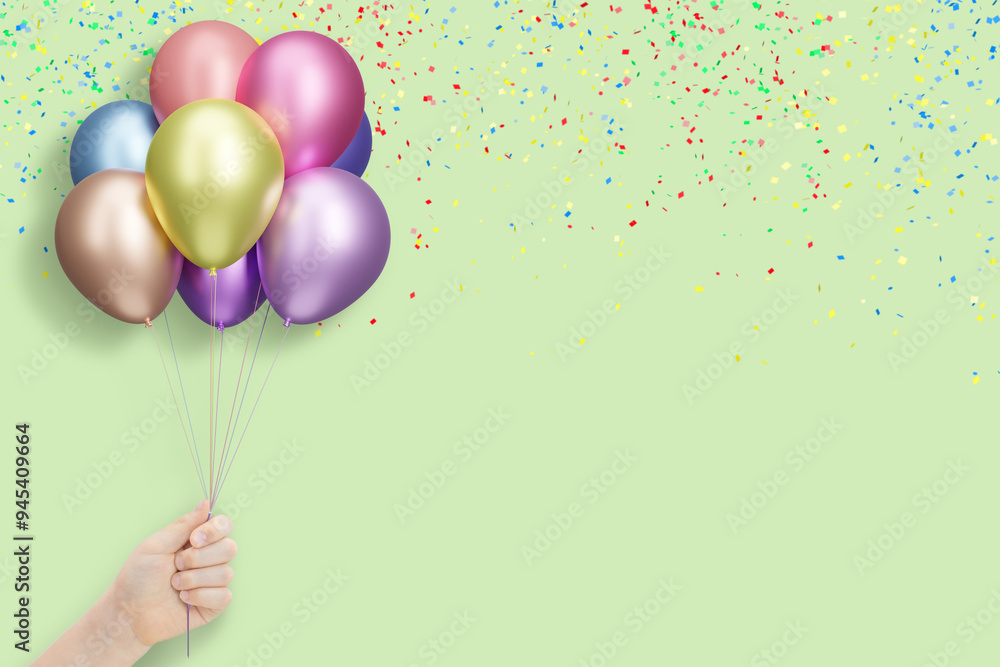 Poster female hand holding bunch of shiny colorful balloons on mint background with confetti. empty space f