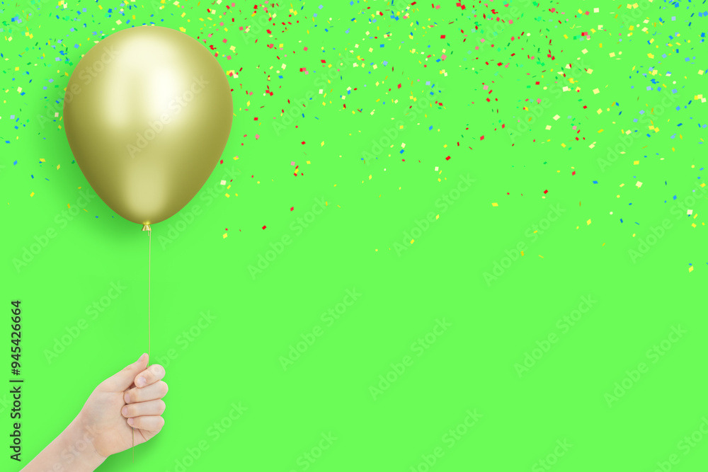 Poster female hand holds golden balloon on green background with confetti. empty space for text