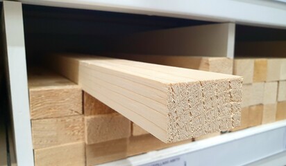 Wooden block close-up in a hardware store on a shelf. Wooden blocks for construction, repair, interior.  Wooden board, new boards in a hardware store. Wood products, lumber, stack of boards.
