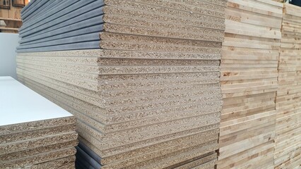 Sale and purchase of wooden chipboards in a hardware store. Construction materials for furniture...