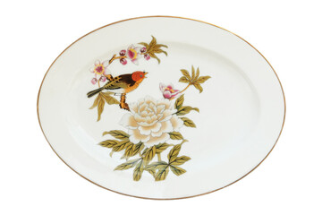 Plate with a pattern of birdie isolated on a white background. Oval ceramic dish. Tableware. Top...