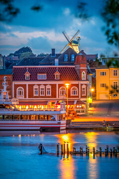 View to some buildings at the riverbank of river Schlei in the small city of Kappeln in Germany at blue hour