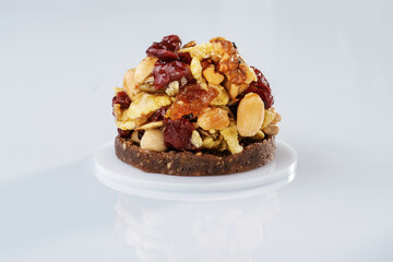 Small sweet dessert with chocolate and almonds isolated against white background
