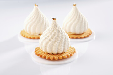 On the yellow cookie. Sweet cakes on the white surface