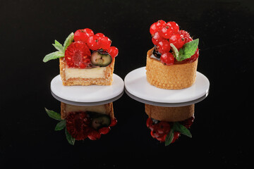 Vibrant fruit. Desserts, sweets on the black background