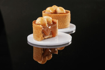 On the black background. Desserts, sweets