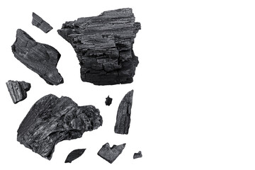Natural wooden charcoal isolated on white background with full depth of field. Top view with copy space for your text. Flat lay