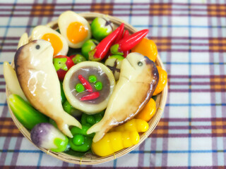 kanom Look Choup in fish mackerel, chily sauce and vegetable shaped
