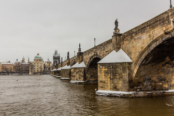 Obraz premium Winter view of Charles bridge in Prague, Czech Republic