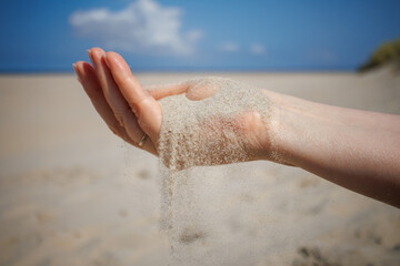 Grains of sand falling