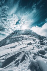 A mountain landscape with heavy snowfall and cloudy skies