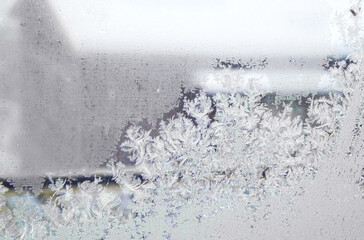 Frosty winter pattern on glass