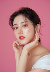 Radiant Korean Model with Natural Beauty and Soft Makeup on a Pink Background