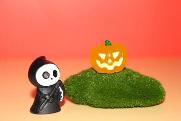 A captivating Halloween illustration showcasing pumpkins, a grim reaper, skulls, ghosts, and somber...