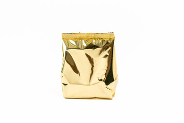 Close-up of golden foil bag on a white background