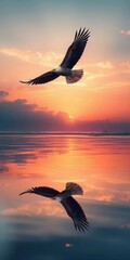 Majestic Eagle Soaring Over a Serene Sunset Reflection in the Ocean
