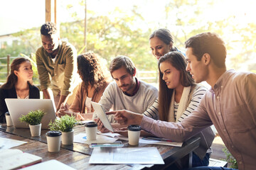Team, business people and discussion at cafe with tablet for remote work and brainstorming ideas....