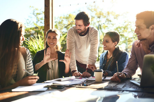 Happy team, discussion and business people brainstorming at cafe to pitch startup ideas and creative solution. Group, smile and meeting of workers at coffee shop for planning or talk with publicist