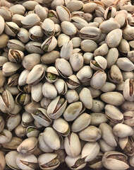 Roasted pistachios background. Top view