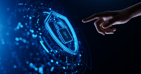 Hand touching a digital shield icon. Cyber Security and Data Protection concept