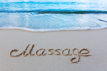 Word massage handwritten on the caribbean sand.
