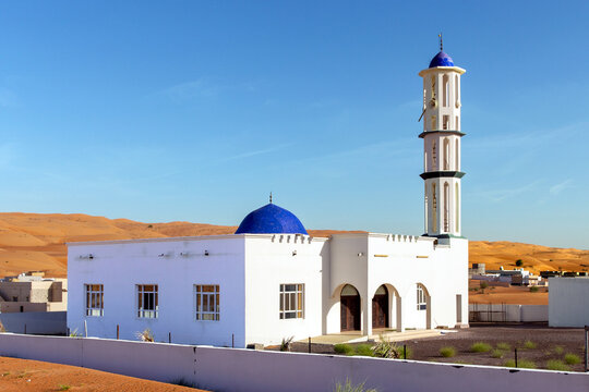 Mosque in city of Al Raqa among sand and sand dunes. Sultanate of Oman