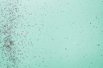 Chipped paint on light green textured surface with scattered flakes and rough details Generative AI
