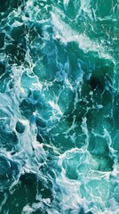Fototapeta premium Majestic Ocean Waves Creating a Beautiful White Foam Amidst Turquoise Green Waters