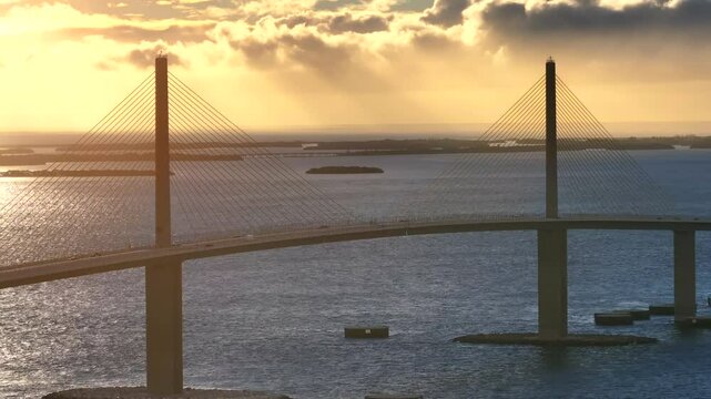 Aerial view of skyway bridge over tranquil tampa bay at sunset with beautiful reflections, St Petersburg, United States.