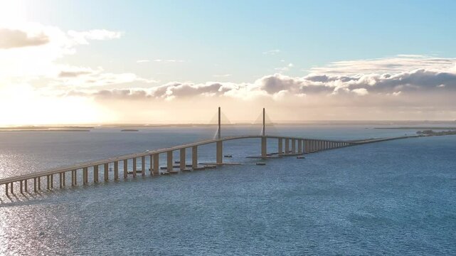 Aerial view of the iconic skyway bridge spanning Tampa Bay during sunset, St Petersburg, United States.