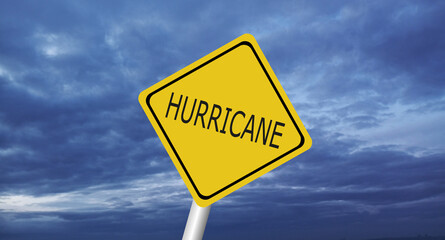 danger,caution,Hurricane Idalia warning sign against a powerful stormy background with copy space. Dirty and angled sign with cyclonic winds add to the drama.hurricane season sign on cloudy background