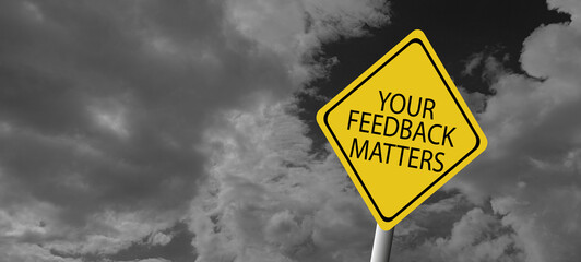 Top view image white paper card written text your feedback matters with a pen.