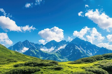 Fototapeta premium Stunning mountain landscape under a vibrant blue sky, featuring lush green meadows and majestic peaks, perfect for nature enthusiasts.