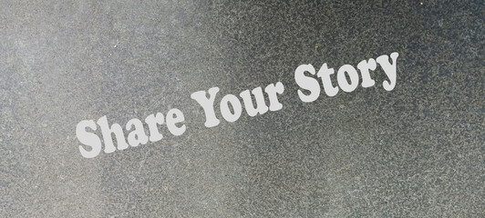 Share your story symbol. Wooden blocks with words Share your story. Beautiful grey background. Businessman hand. Business and Share your story concept. Copy space.