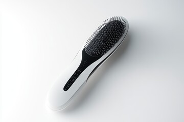 A sleek hairbrush featuring a black and white design, perfect for styling and detangling hair effortlessly.