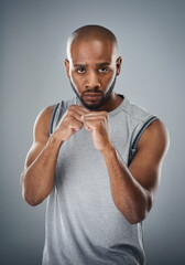 Black man, portrait and fists for martial arts in studio, fighter and battle or warrior on gray background. Male person, punch exercise and combat training, sports challenge and boxer for workout