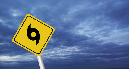  danger,Hurricane Idalia warning sign against a powerful stormy background with copy space. Dirty and angled sign with cyclonic winds add to the drama.hurricane season sign on cloudy background
