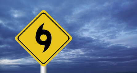  danger,Hurricane Idalia warning sign against a powerful stormy background with copy space. Dirty and angled sign with cyclonic winds add to the drama.hurricane season sign on cloudy background