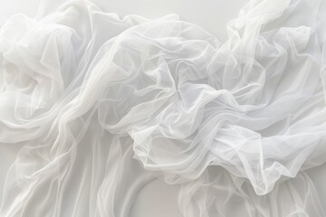 Fototapeta premium This image features an elegant spread of white fabric, artistically draped and arranged in soft, flowing layers, evoking purity, simplicity, and sophistication.