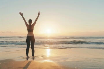 Fototapeta premium A person standing on the beach at sunset, arms raised in joy. This captures freedom and happiness. Ideal for wellness and relaxation themes. Generative AI