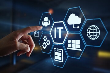 IT Solutions at Your Fingertips: A hand interacts with a holographic interface showcasing IT services, emphasizing innovation in technology and support. 