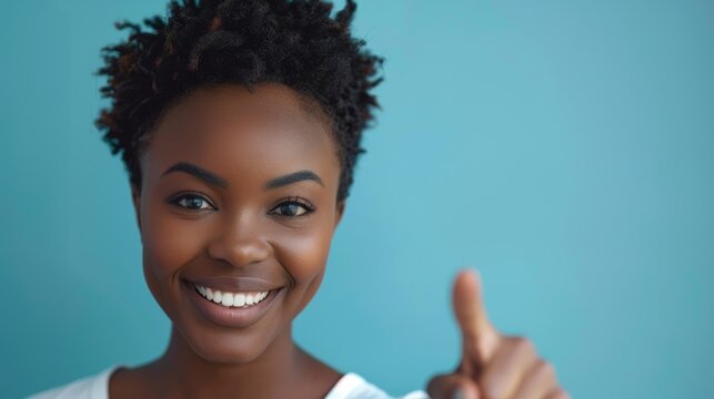 Portrait of a smiling woman pointing towards the viewer in a studio setting, promoting choice and encouraging recruitment, with a blue backdrop and inviting emoji