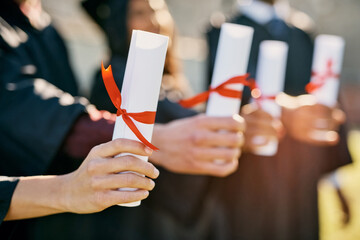 People, graduation and hands with diploma at university for education, success and course achievement. Campus, friends and students with certificate of completion for learning, knowledge and award