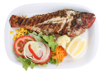 Grilled sea bass with potatoes and vegetables isolated