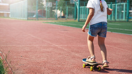 child skater for kid girl playing skateboard or surf skate in skate park