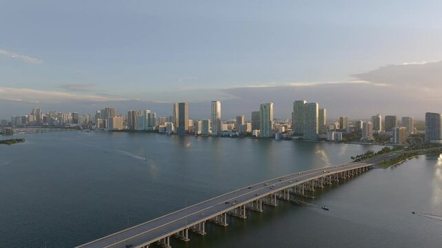 Aerial view of biscayne bay with modern skyline and julia tuttle causeway at sunset, miami, united states.