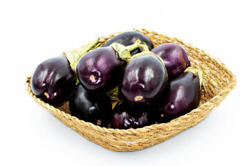 Purple eggplants used for stuffing meals in a basket
