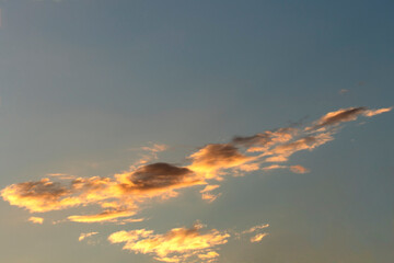 Clouds on blue sky in a sunset time