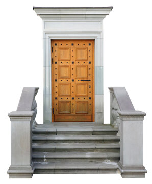 An wooden  door and stucco staircase decorate the entrance to the aold  building isolated